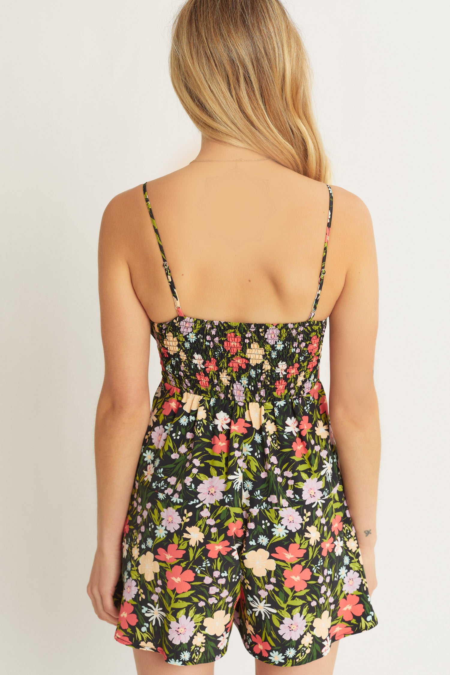 Black Floral Romper. Close up view.